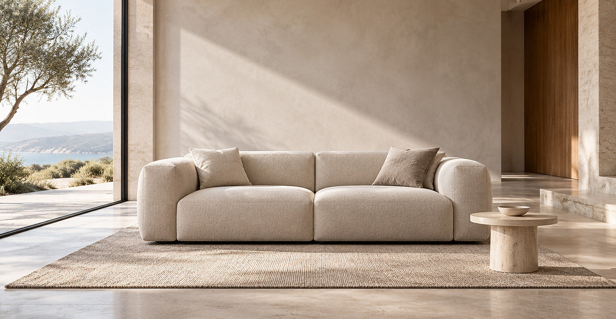Minimal cream modular sofa showcased in bright refined living space