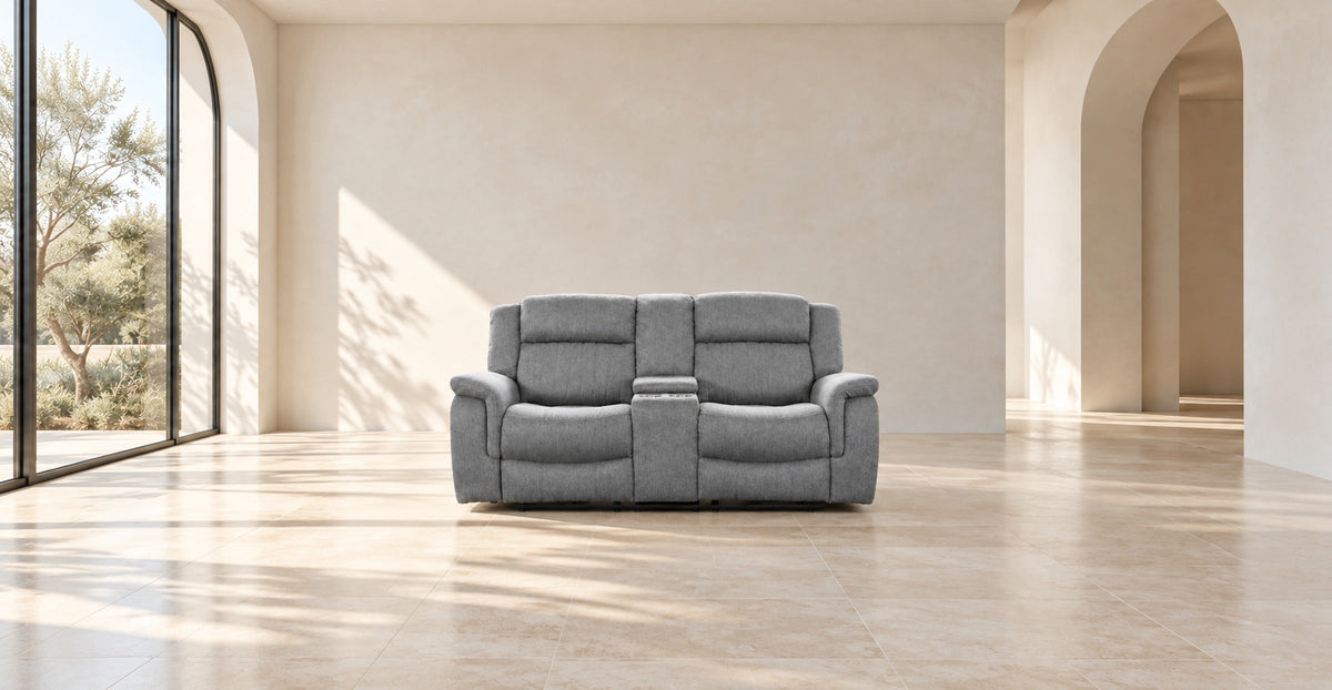 Grey two-seater recliner sofa with centre console in a bright minimalist living room