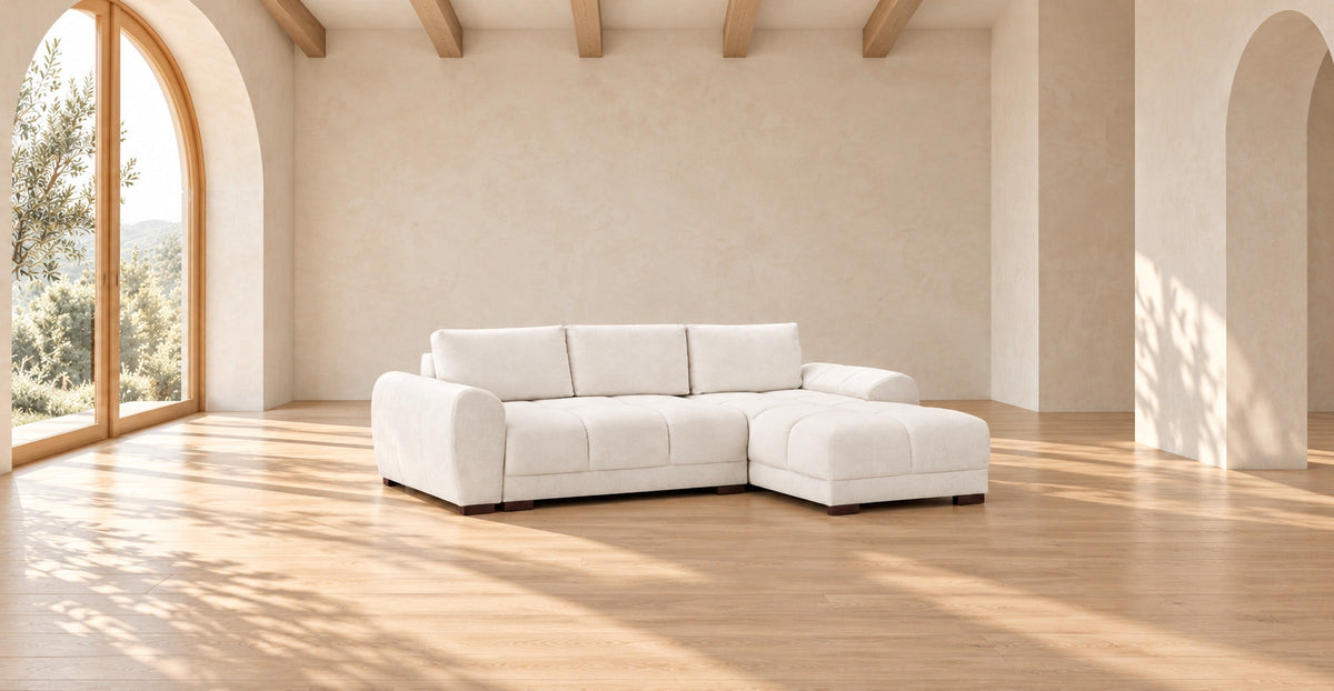 Cream U-shaped Azzuro corner sofa bed in a minimal warm interior