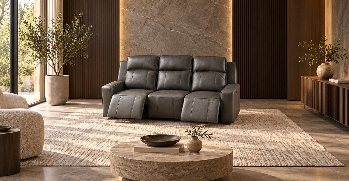 Dark grey leather three-seat Barcelona power recliner in a modern fluted oak lounge