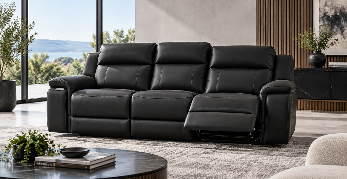 Conway black electric reclining three-seater sofa in a contemporary living room — Ivaaj