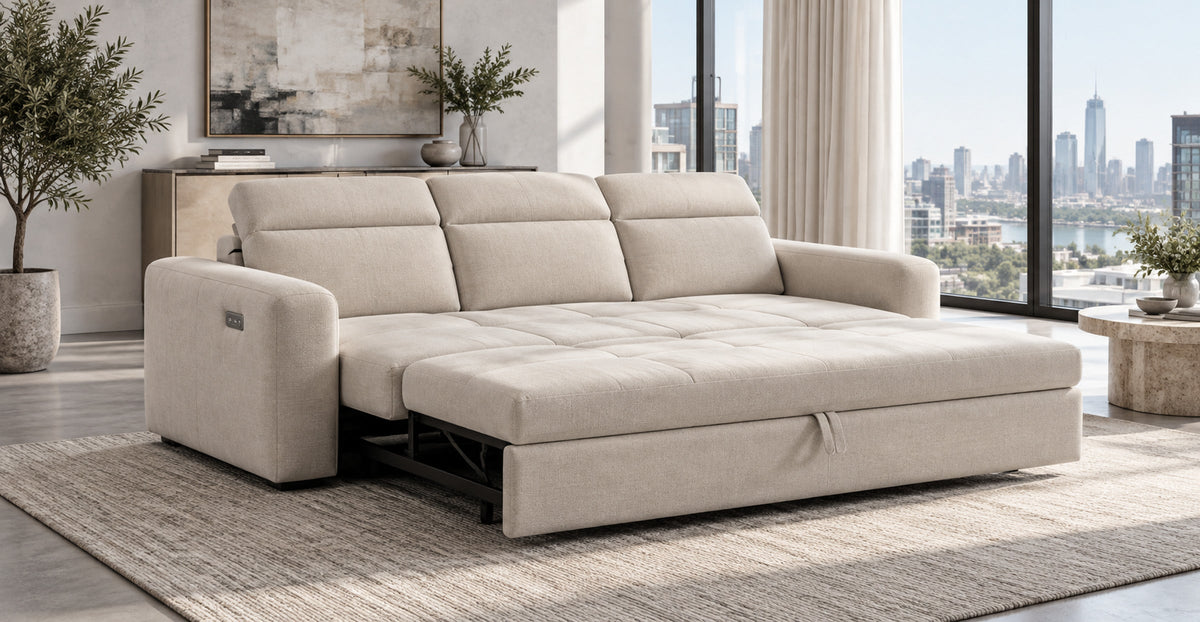 Dakota electric three-seater sofa bed extended in a contemporary city apartment — Ivaaj