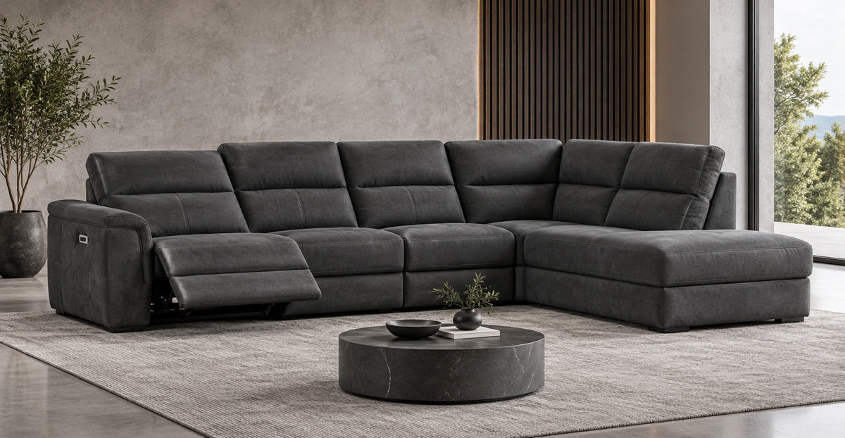 Denver charcoal electric reclining corner sofa with extended footrest in a modern lounge — Ivaaj