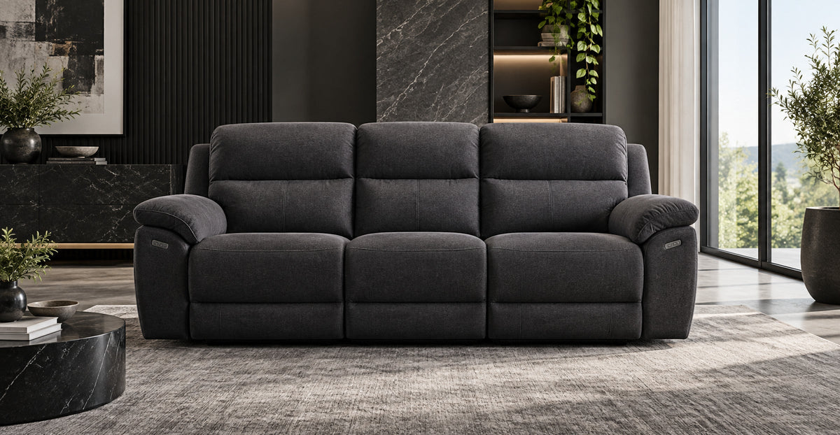 Harrison charcoal electric reclining three-seater sofa in a refined modern living room — Ivaaj