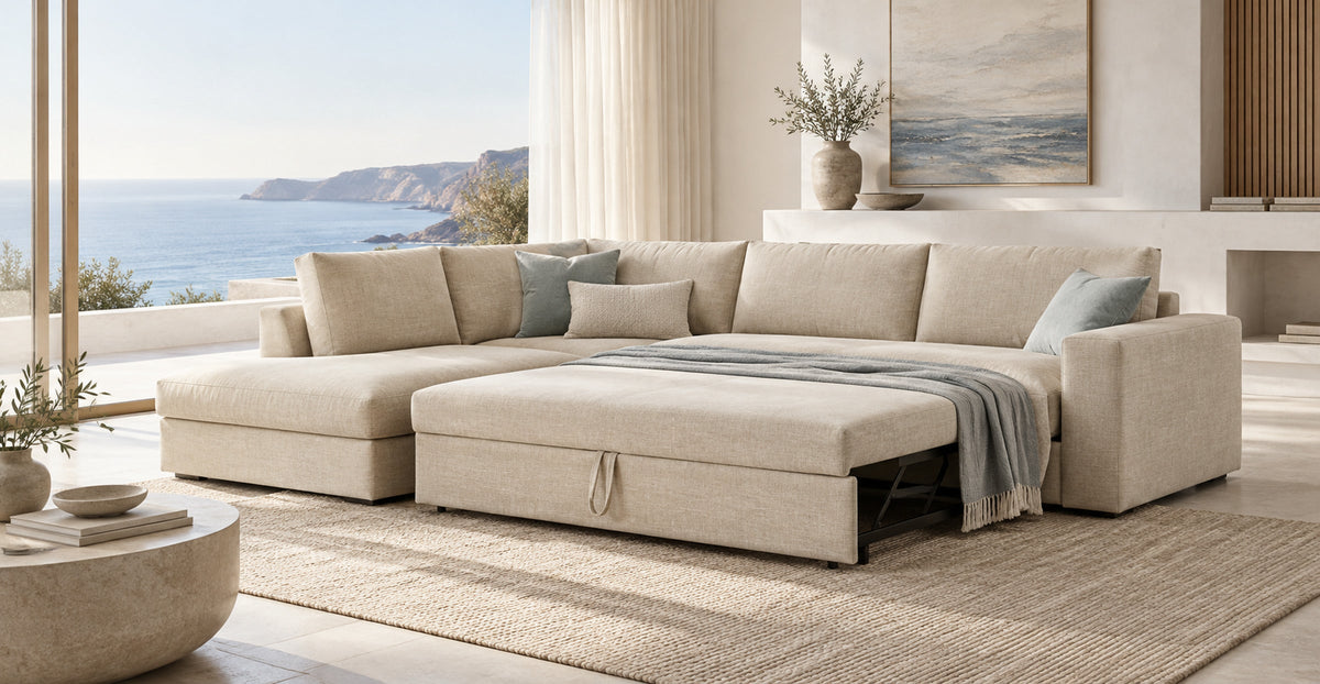 Hudson beige corner sofa bed with pull-out sleeping surface in a coastal living room — Ivaaj